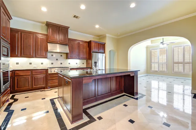 a view of wooden floor and chandelier in a room