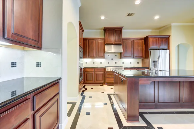 a bathroom with a sink vanity and a mirror