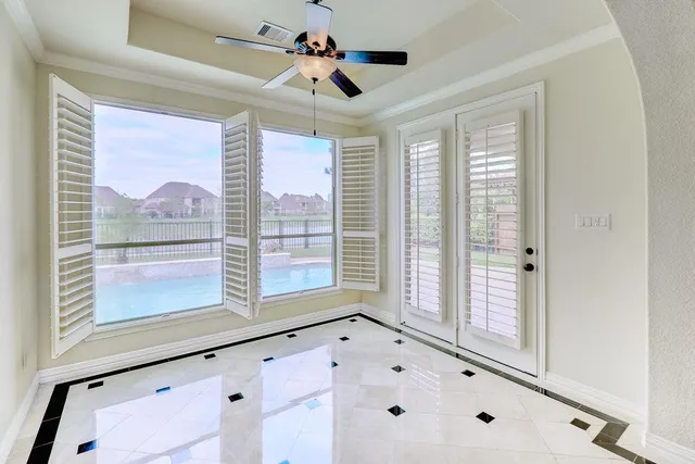 a view of an empty room with a window