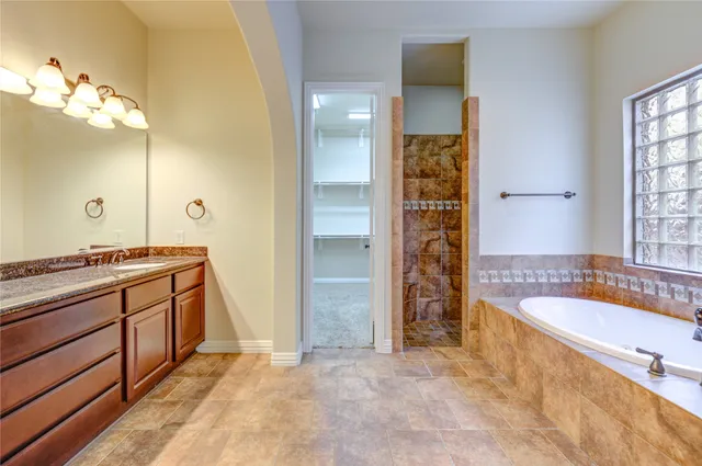 an aerial view of a house with a yard and outdoor seating