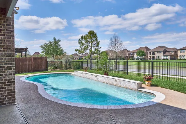 a view of a swimming pool with a terrace