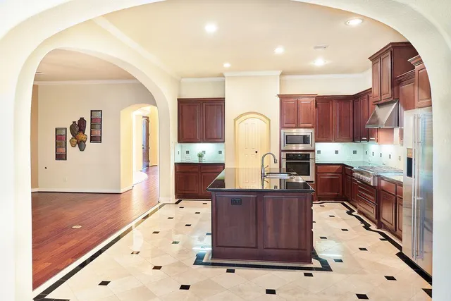 a view of an chairs and table in patio