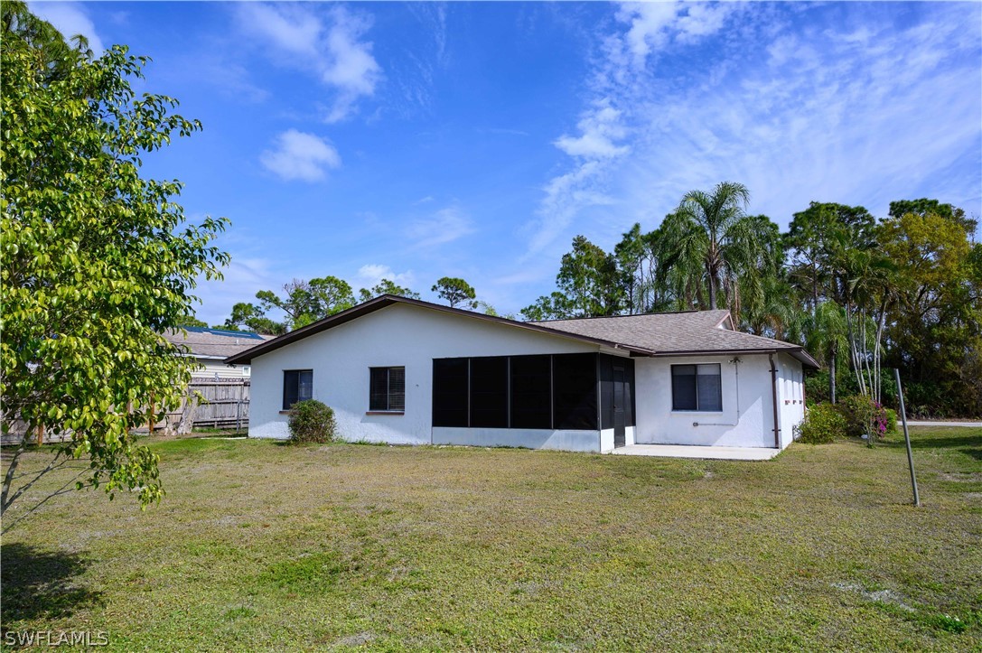 18430 Hepatica Road Fort Myers, FL 33967 - Photo 15 of 16 a front view of a house with a garden
