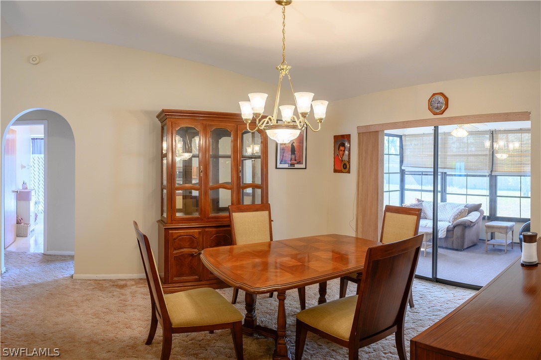 18430 Hepatica Road Fort Myers, FL 33967 - Photo 6 of 16 a view of a dining room with furniture and window