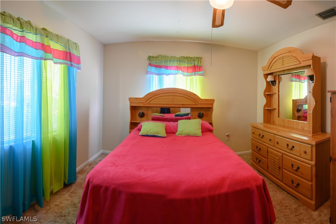 18430 Hepatica Road Fort Myers, FL 33967 - Photo 10 of 16 a bedroom with a bed and a dresser