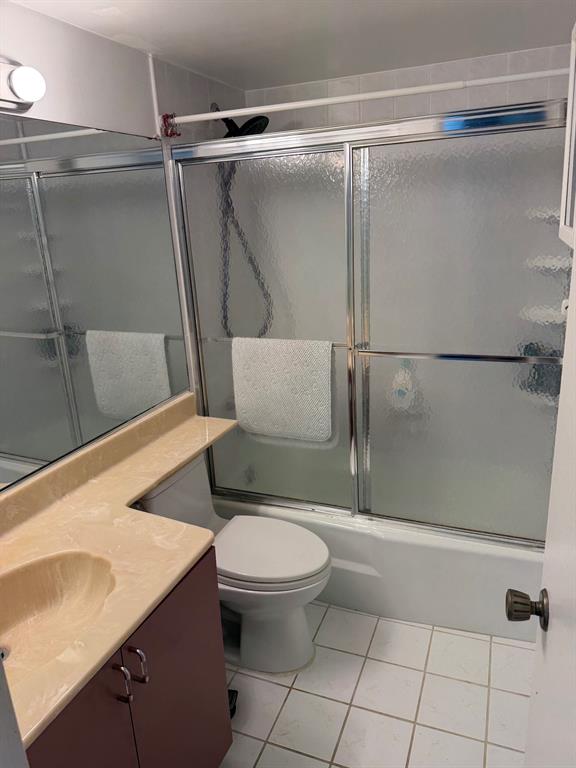 4502 North Federal Highway, Unit 235D Lighthouse Point, FL 33064 - Photo 15 of 40 a bathroom with a granite countertop sink toilet and shower