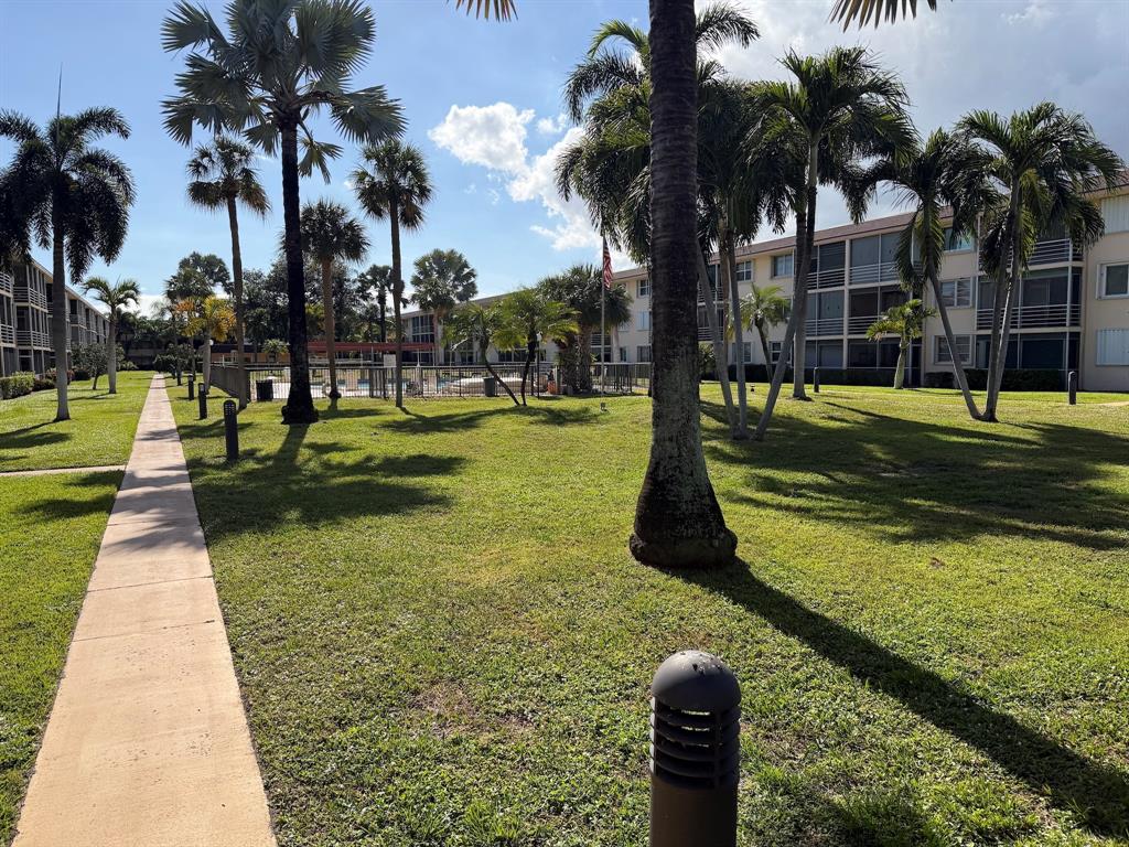 4502 North Federal Highway, Unit 235D Lighthouse Point, FL 33064 - Photo 29 of 40 a view of a yard with swimming pool