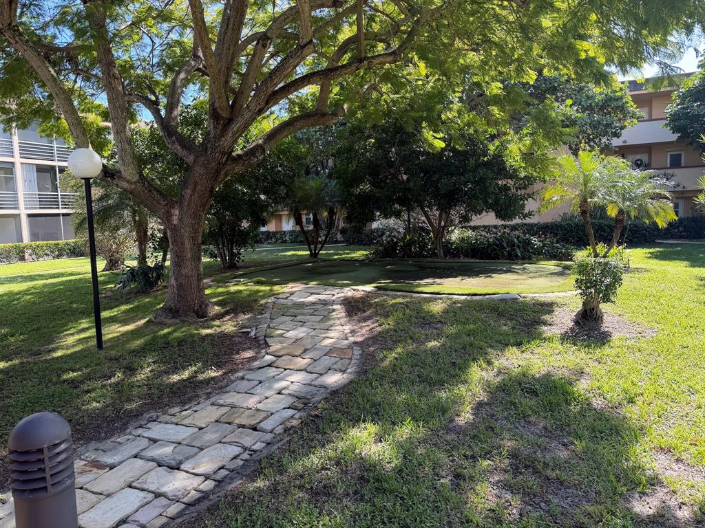 4502 North Federal Highway, Unit 235D Lighthouse Point, FL 33064 - Photo 33 of 40 a view of a backyard with green space