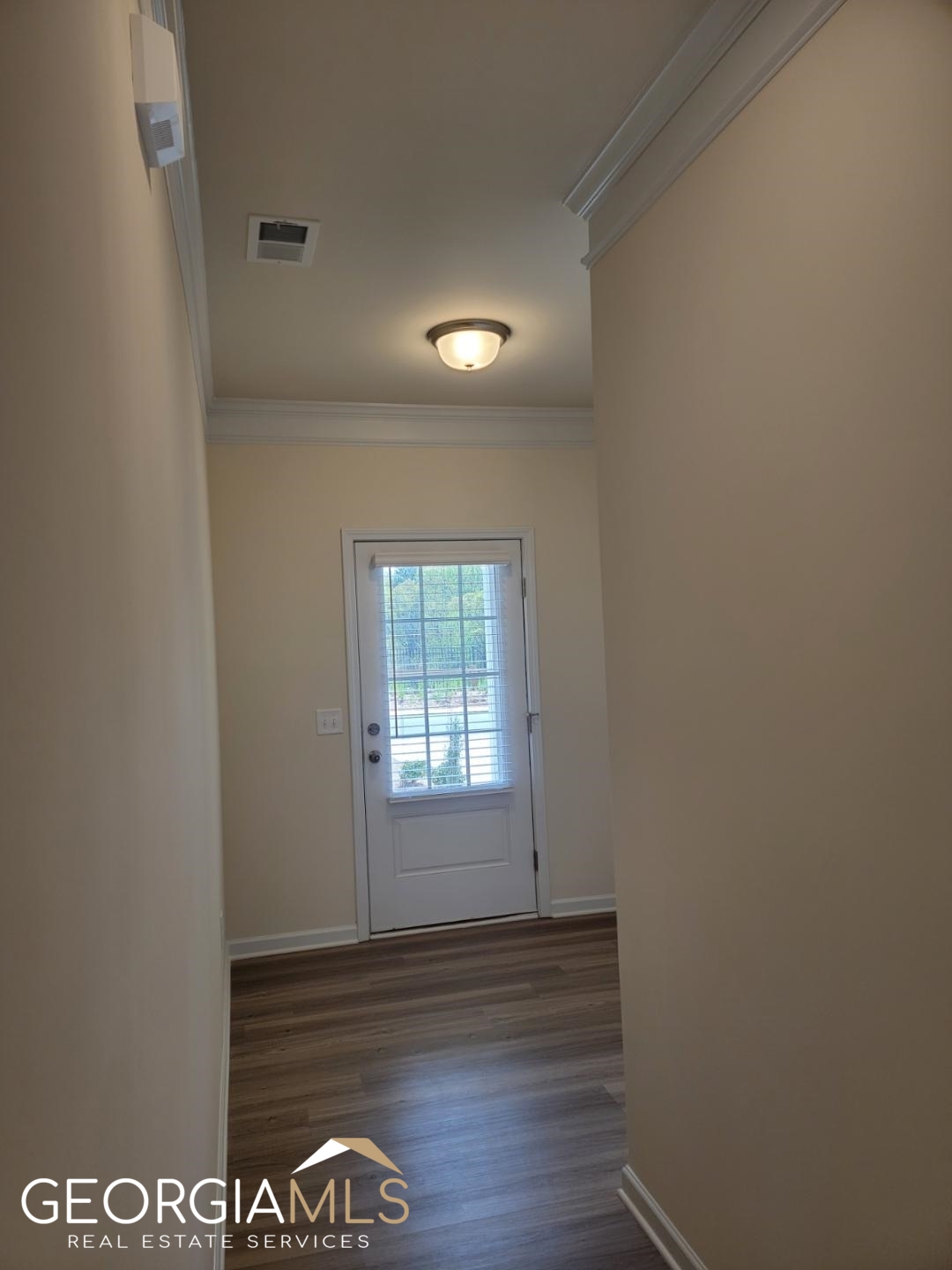 160 Madison Bend Holly Springs, GA 30188 - Photo 17 of 18 a view of an empty room and window