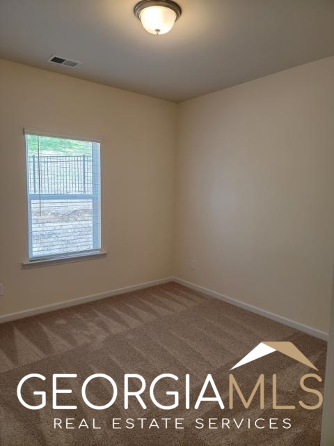 160 Madison Bend Holly Springs, GA 30188 - Photo 9 of 18 a view of an empty room