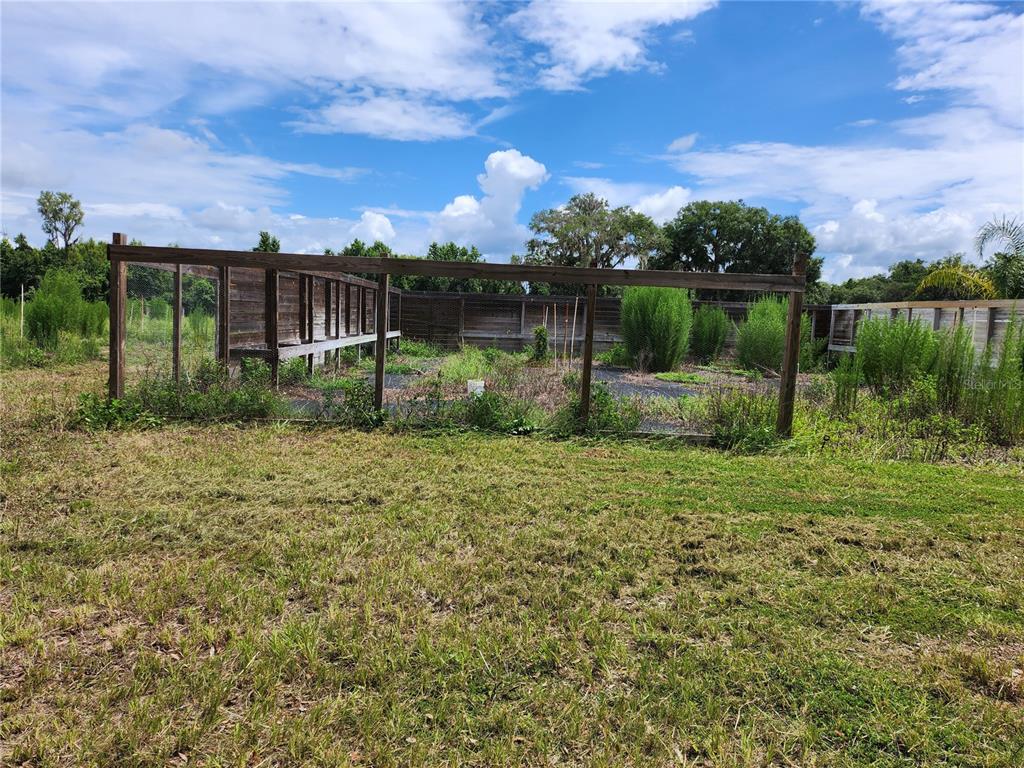 9333 East Bushnell Road Floral City, FL 34436 - Photo 13 of 28 a view of a garden with a lake