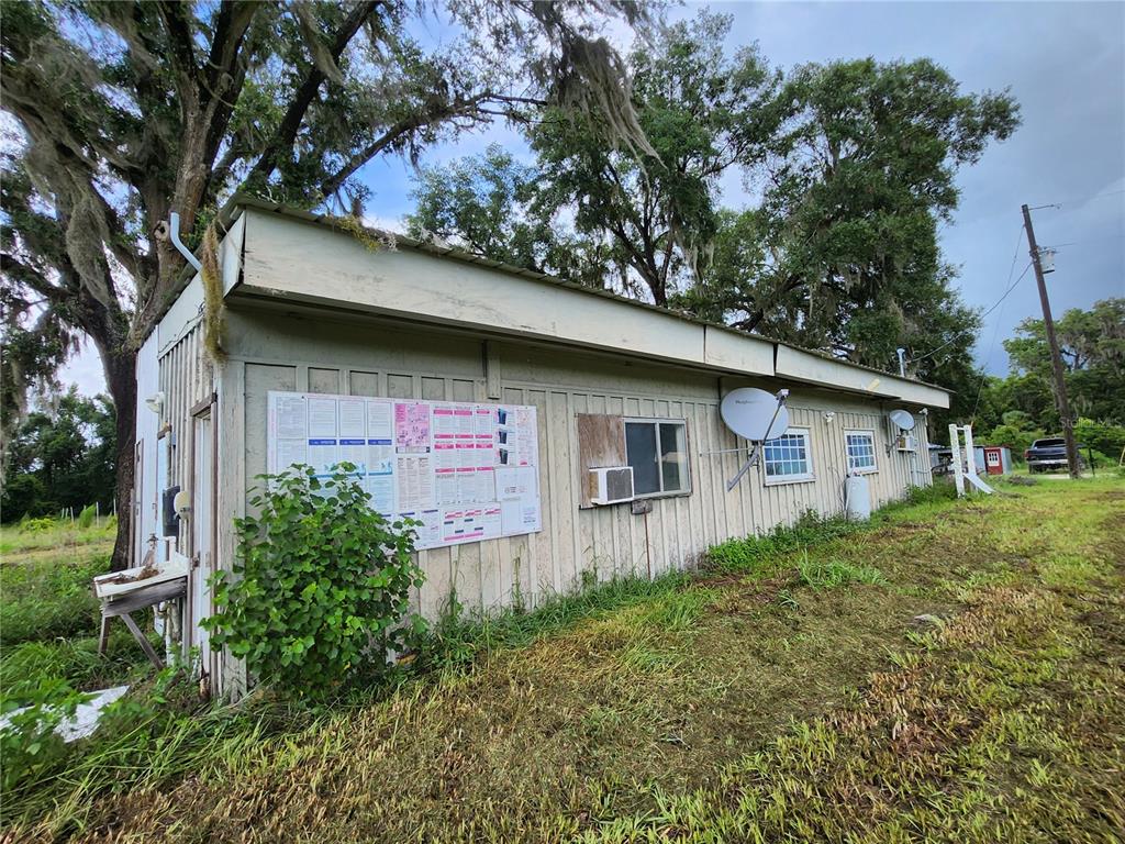 9333 East Bushnell Road Floral City, FL 34436 - Photo 6 of 28 a front view of a house with garden