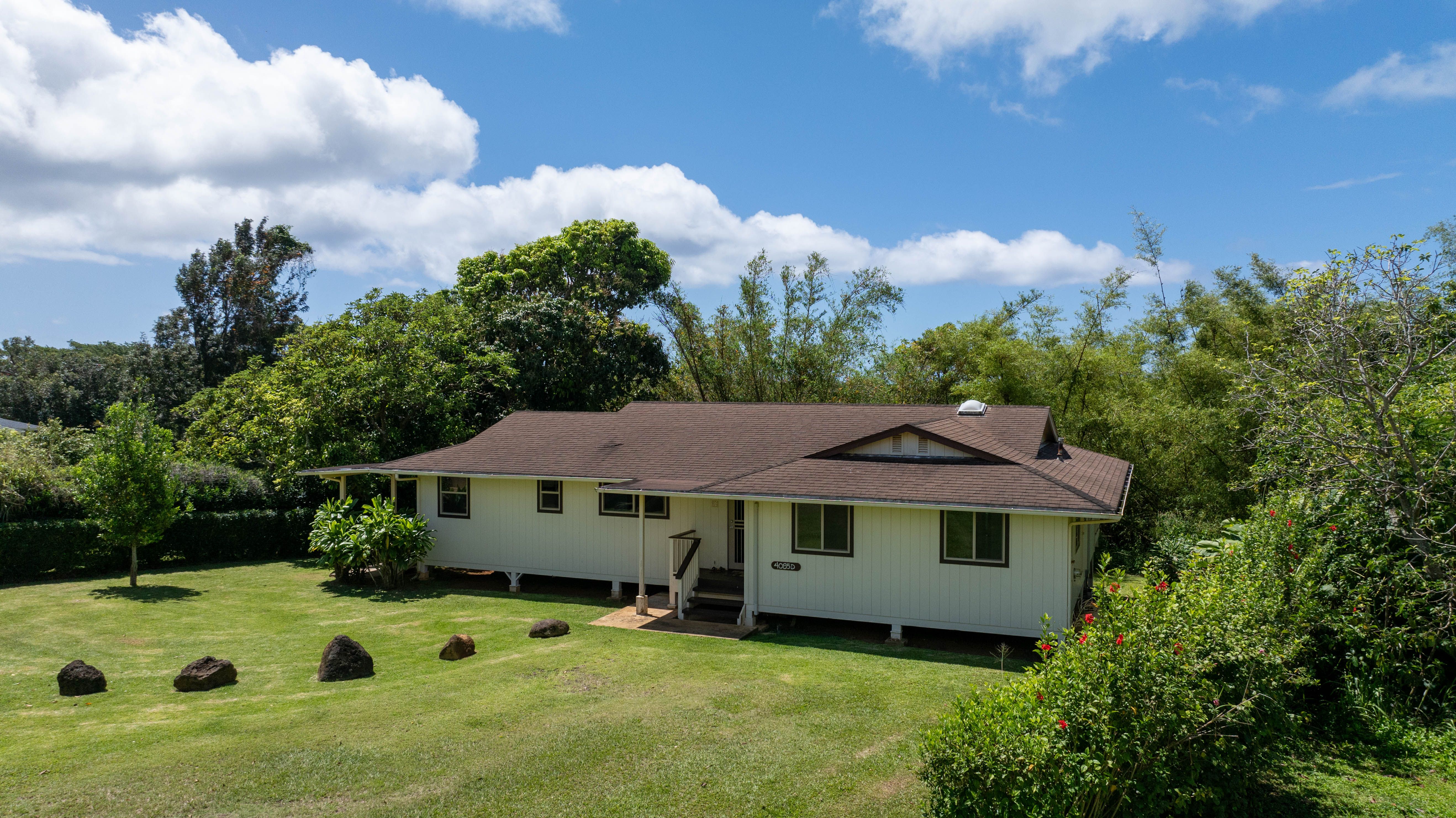 4085 B Noho Road Koloa, HI 96756 - Photo 1 of 30 a front view of a house with garden