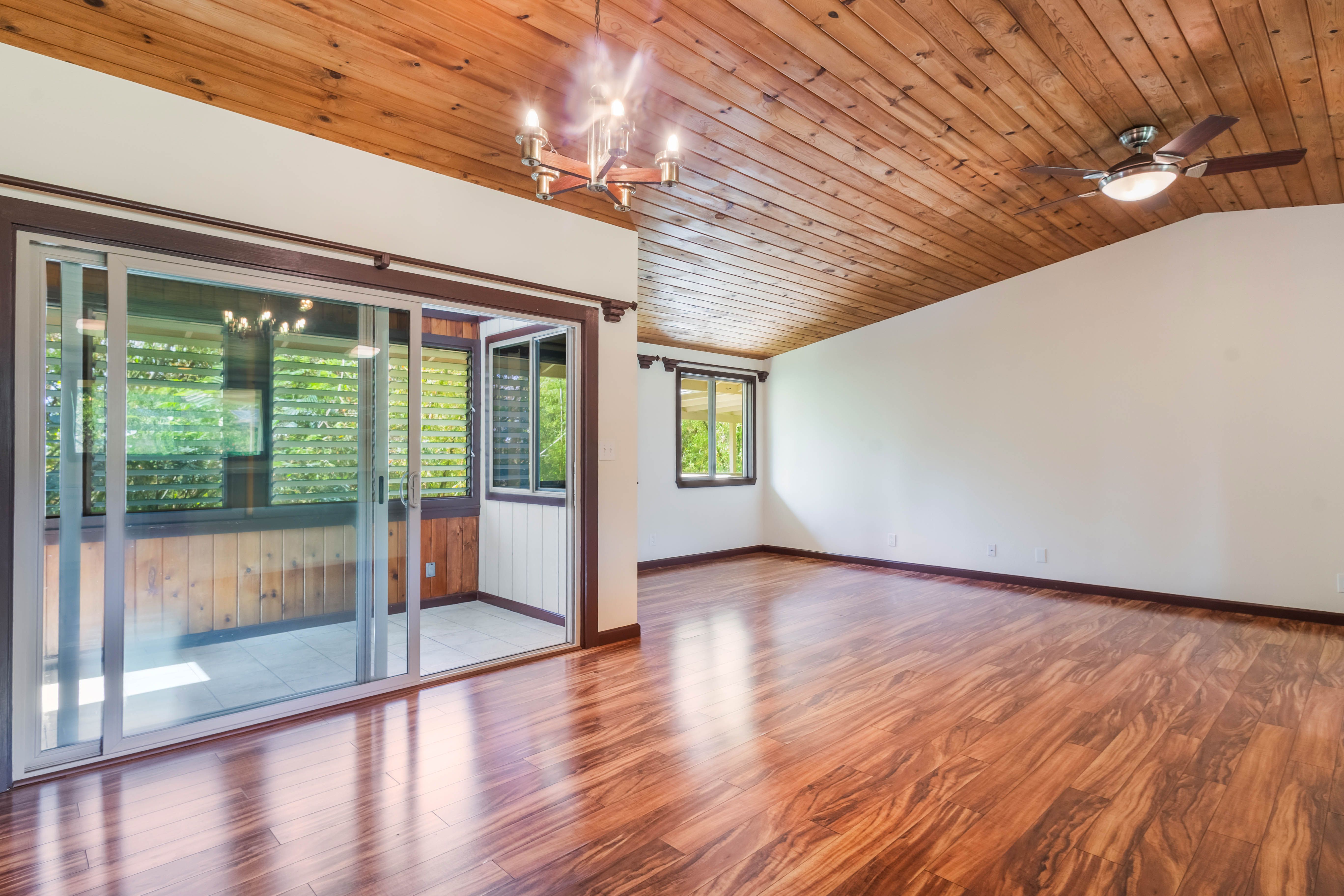 4085 B Noho Road Koloa, HI 96756 - Photo 11 of 30 a view of an empty room with wooden floor and a window