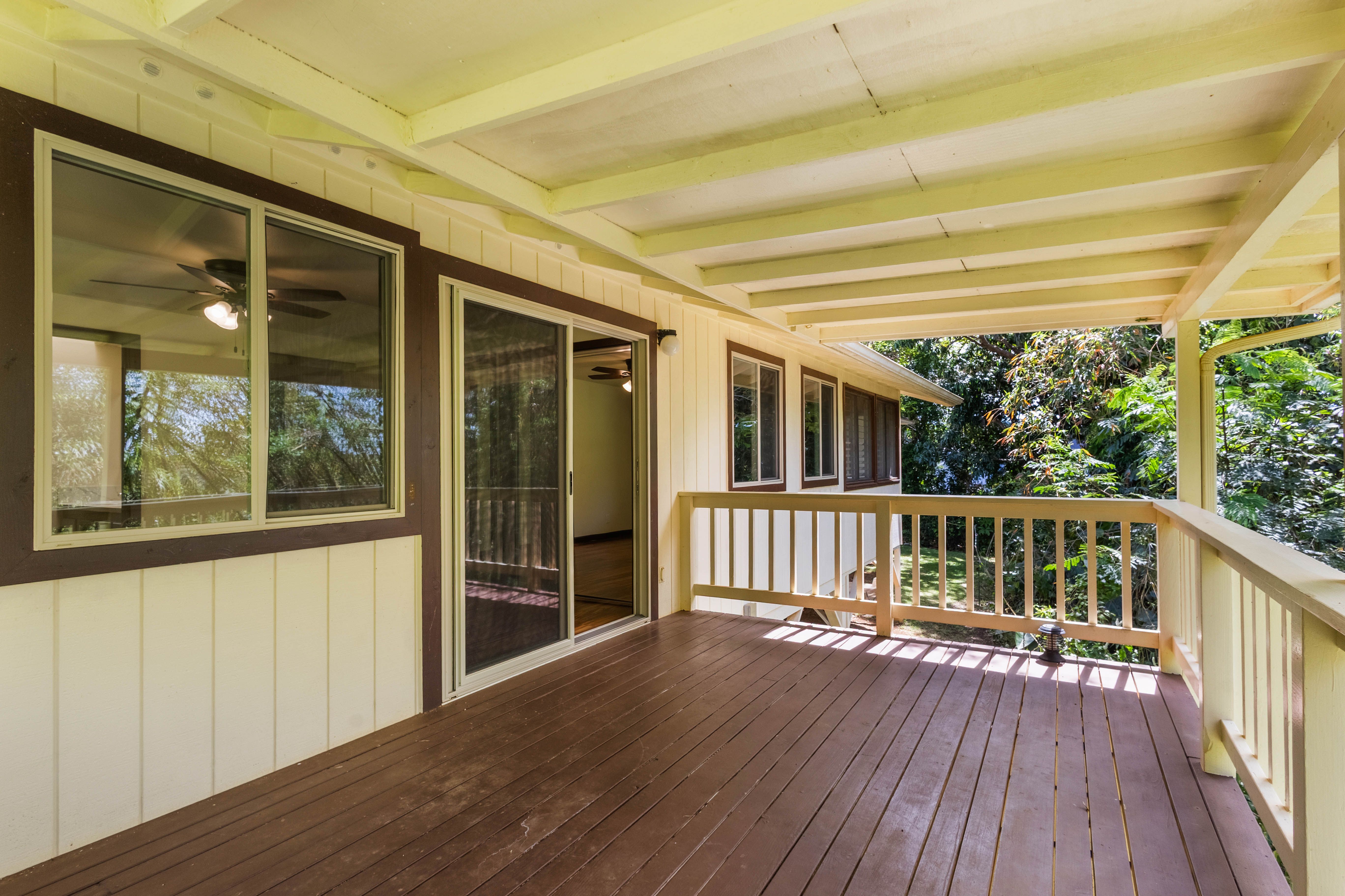 4085 B Noho Road Koloa, HI 96756 - Photo 19 of 30 a view of deck with large windows and wooden floor