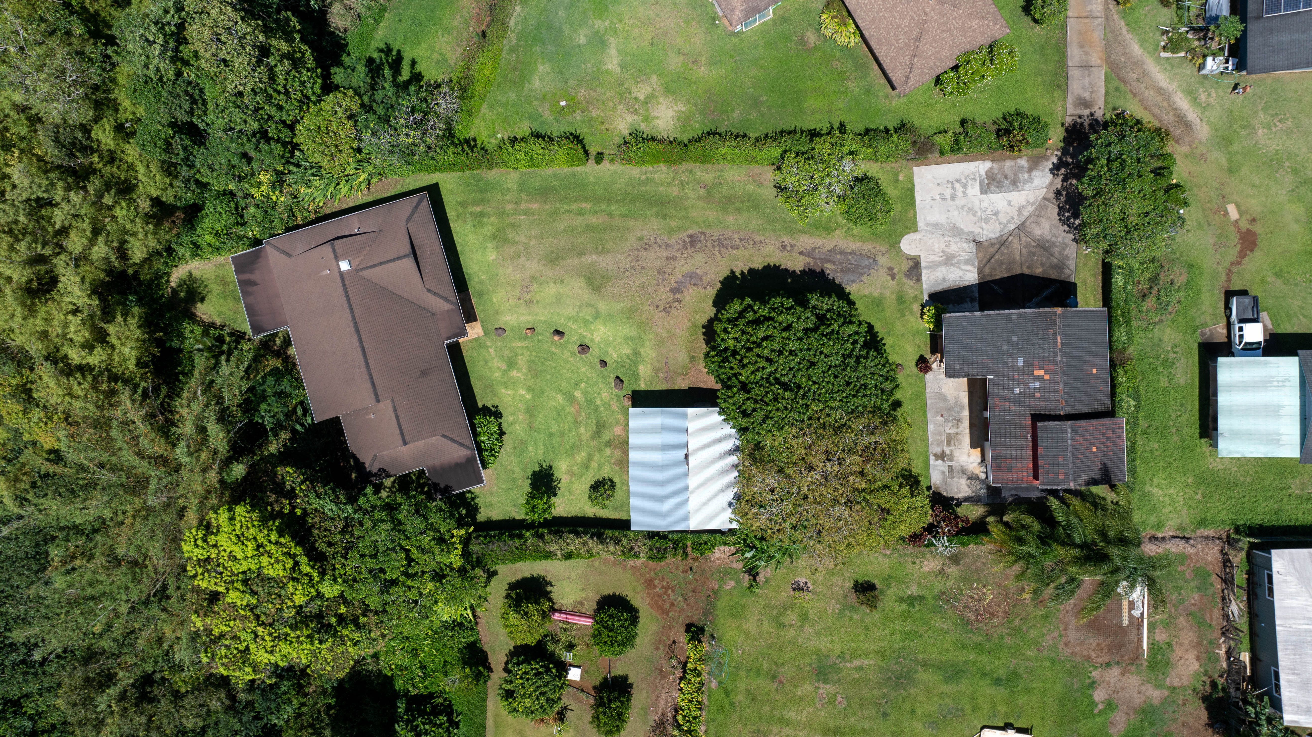 4085 B Noho Road Koloa, HI 96756 - Photo 4 of 30 an aerial view of a house with a yard and trees