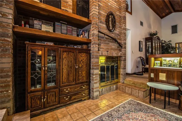 a living room with furniture and kitchen view