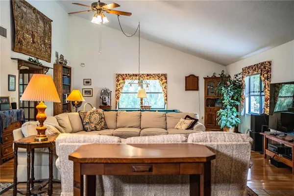 a view of swimming pool with sitting area