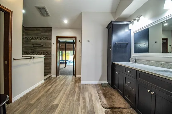 a bathroom with a sink and a mirror