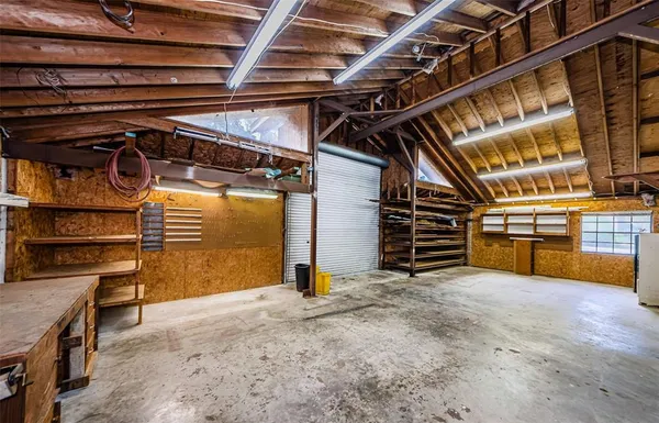 an aerial view of a house with garden space and street view