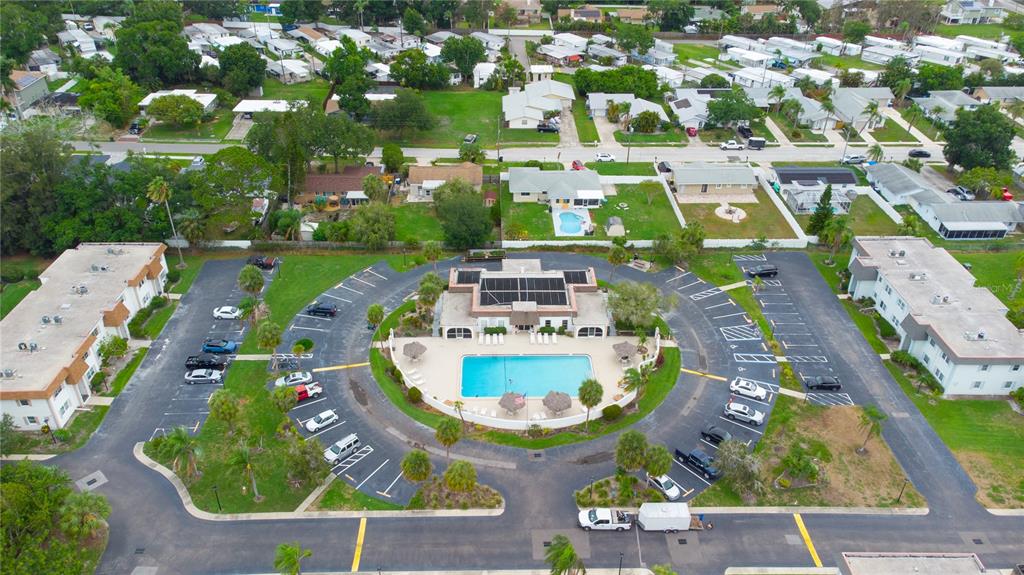 389 South McMullen Booth Road, Unit 12 Clearwater, FL 33759 - Photo 22 of 25 an aerial view of residential houses with outdoor space