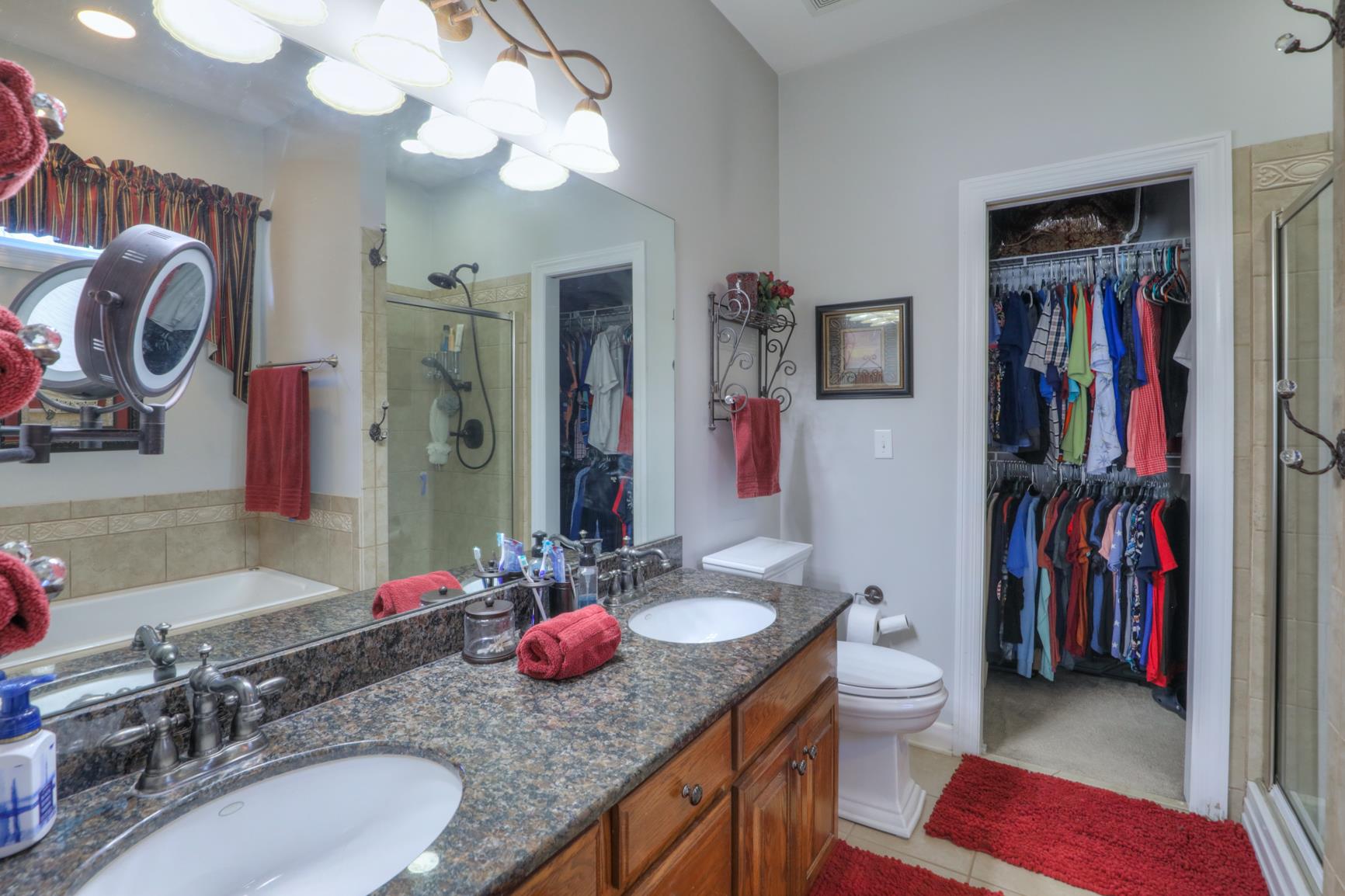 1287 Garton Road Burns, TN 37029 - Photo 12 of 29 a bathroom with a granite countertop sink and a mirror