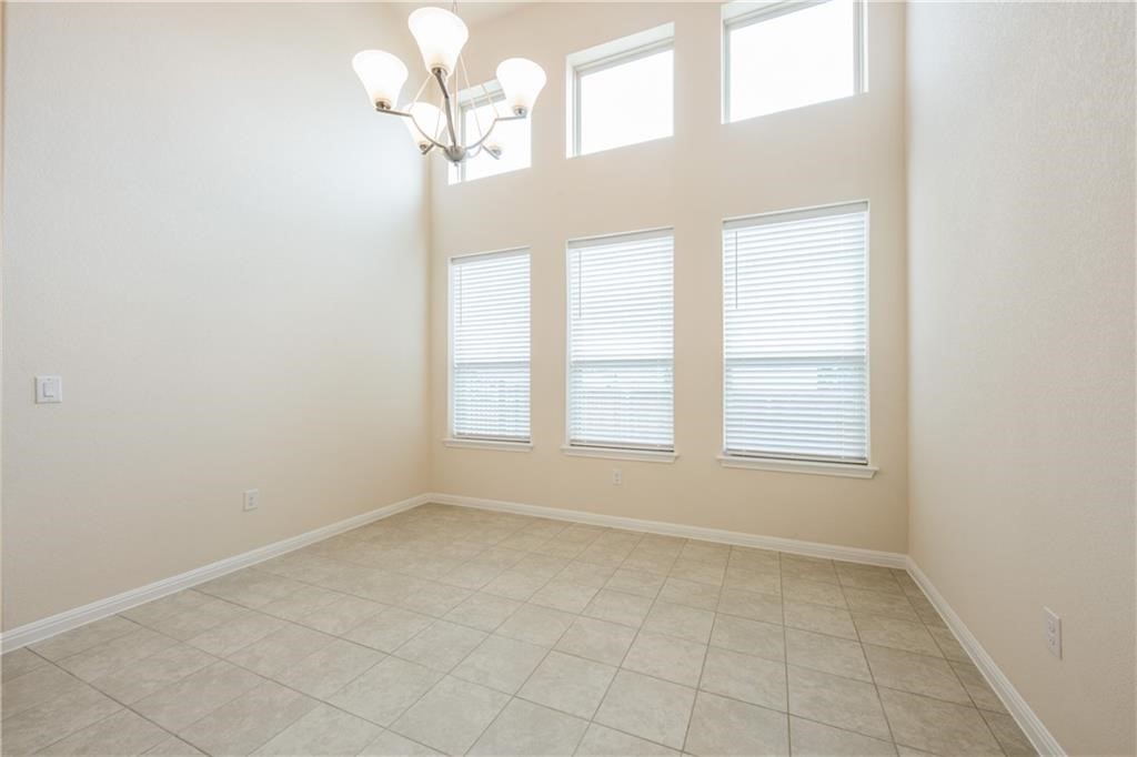 3810 Brushy Creek Road, Unit 67 Cedar Park, TX 78613 - Photo 6 of 19 an empty room with chandelier fan and windows