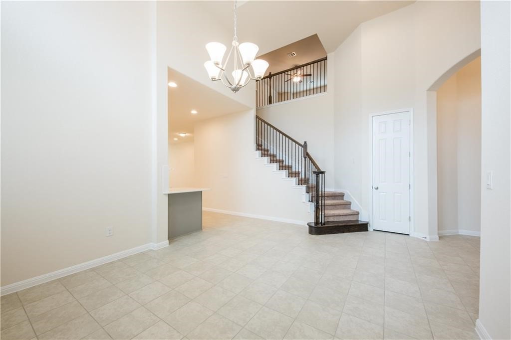 3810 Brushy Creek Road, Unit 67 Cedar Park, TX 78613 - Photo 7 of 19 a view of a hallway with staircase and a chandelier