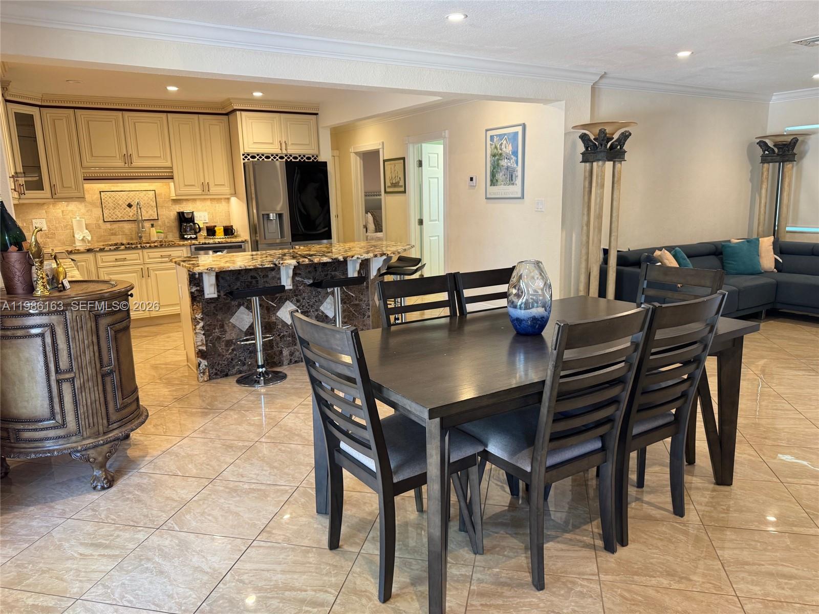 2355 Southeast 7th Street Pompano Beach, FL 33062 - Photo 12 of 31 a view of a dining room with furniture