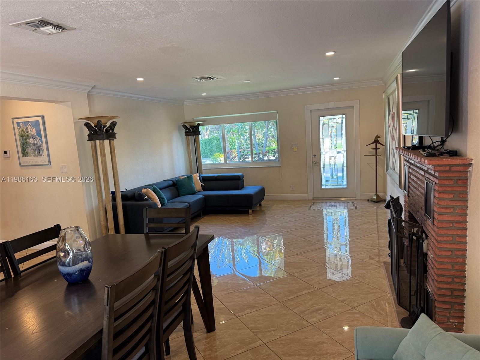 2355 Southeast 7th Street Pompano Beach, FL 33062 - Photo 15 of 31 a livingroom with furniture and a flat screen tv