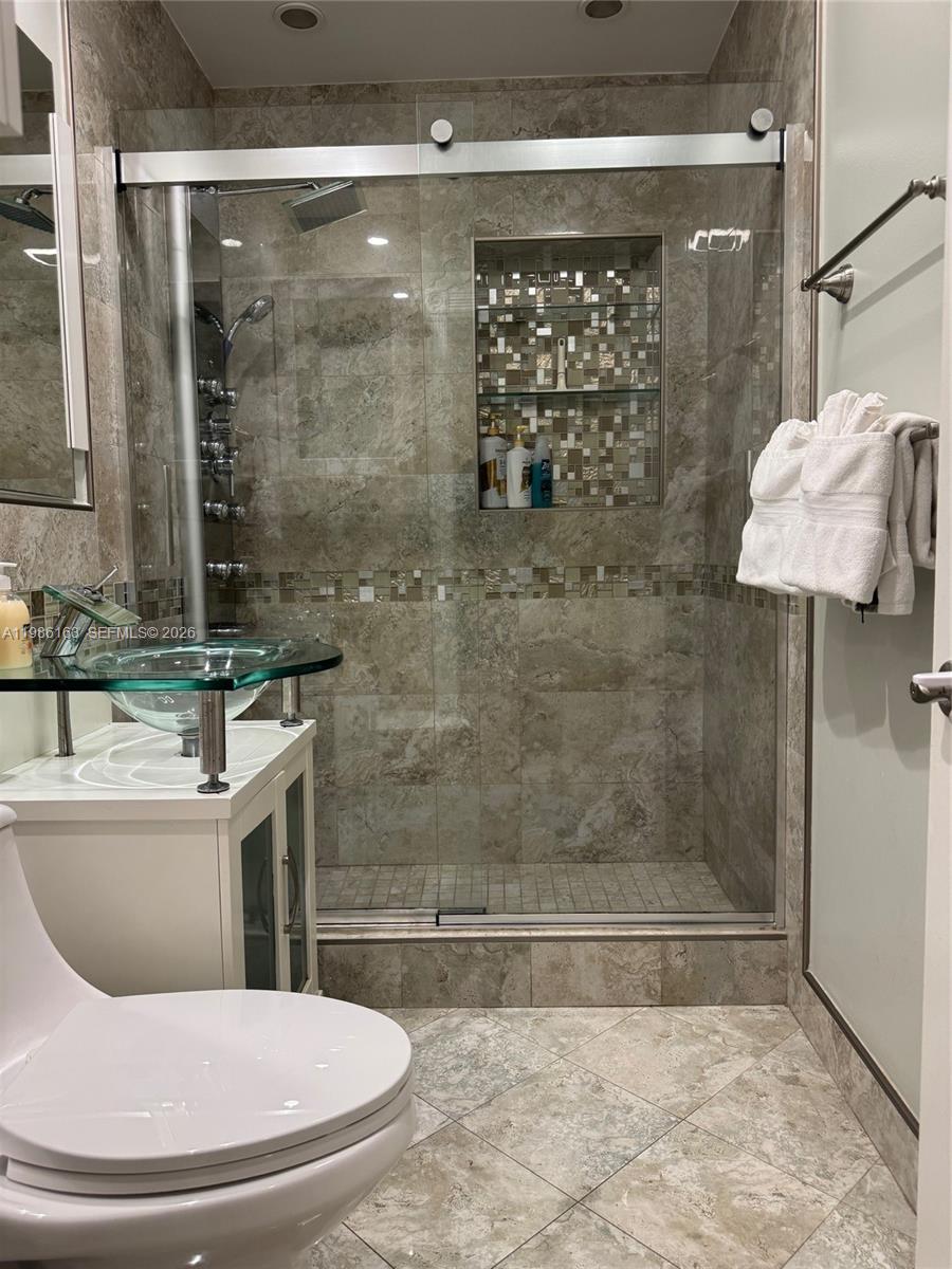 2355 Southeast 7th Street Pompano Beach, FL 33062 - Photo 21 of 31 a bathroom with a shower and a toilet