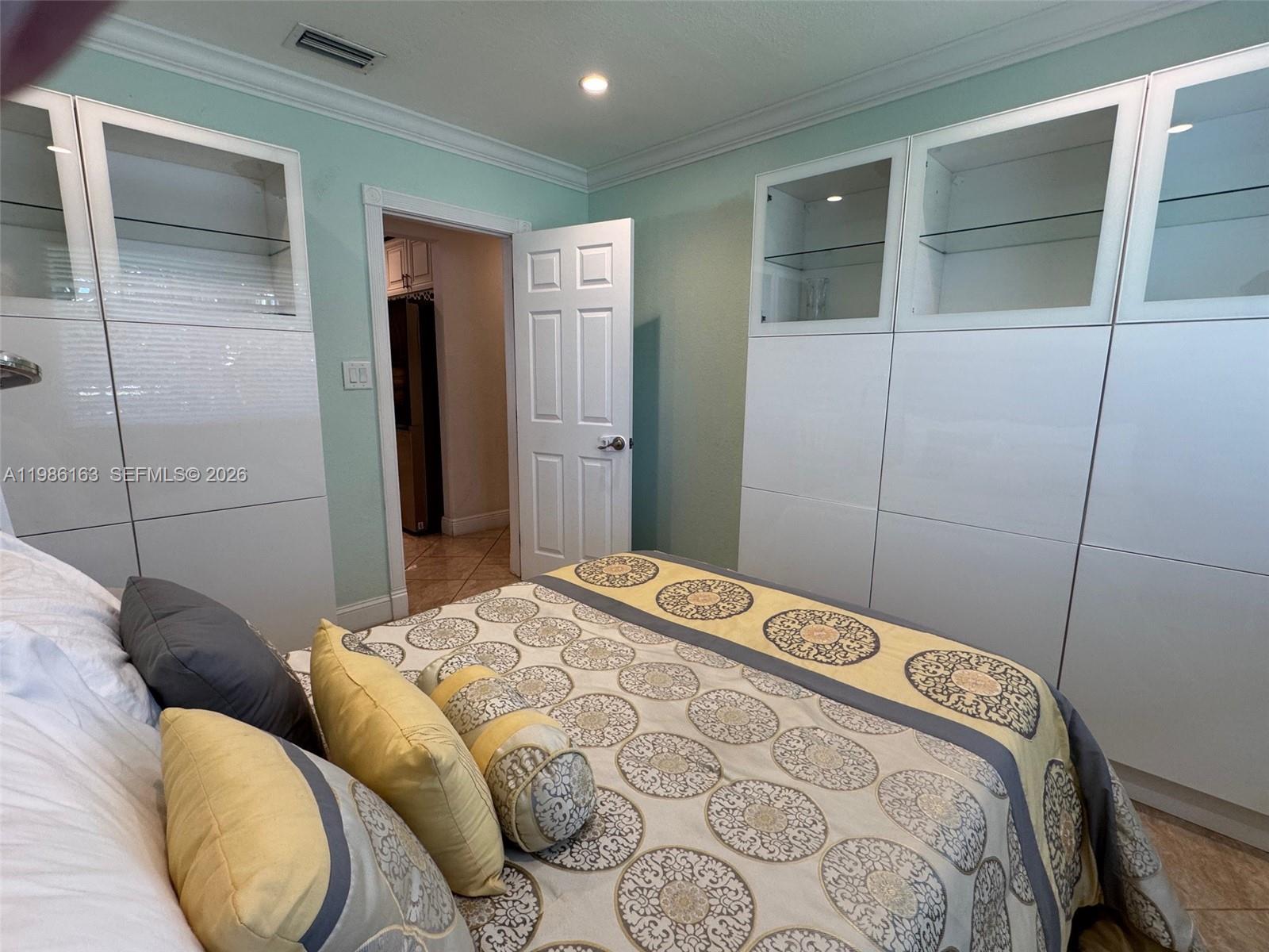 2355 Southeast 7th Street Pompano Beach, FL 33062 - Photo 26 of 31 a bedroom with a bed and a closet