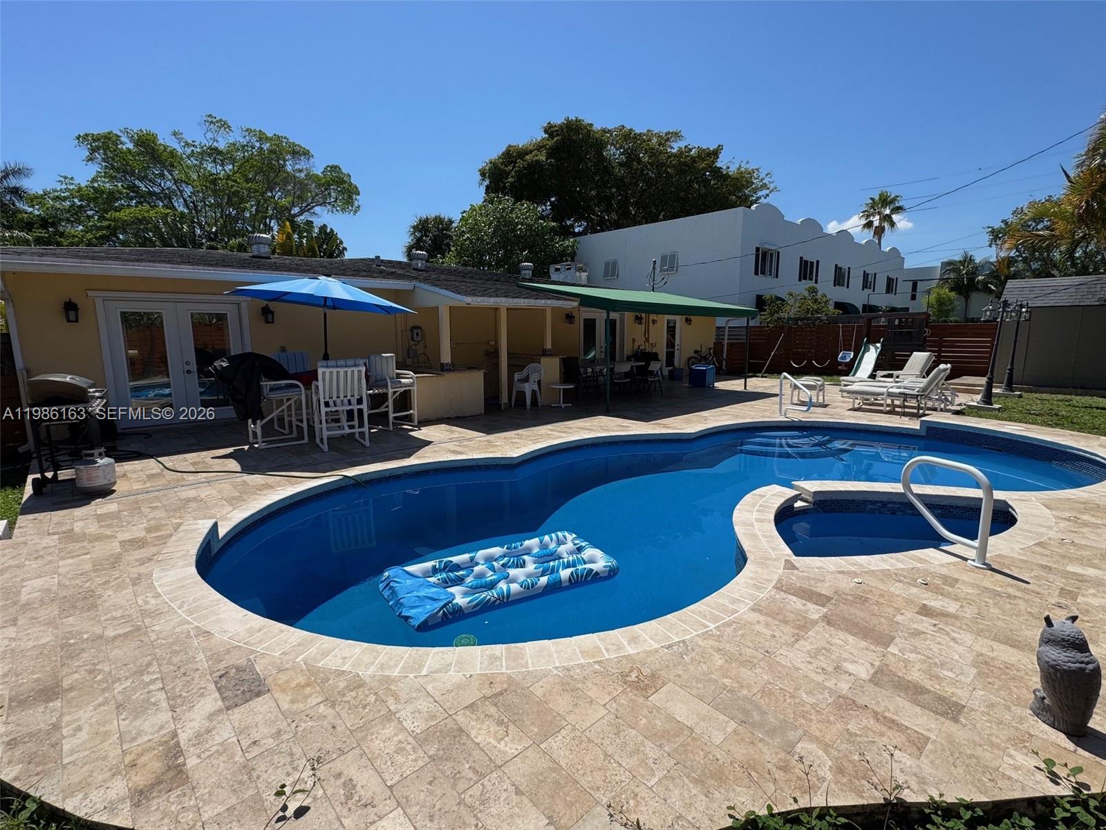 2355 Southeast 7th Street Pompano Beach, FL 33062 - Photo 4 of 31 a view of a swimming pool with a patio