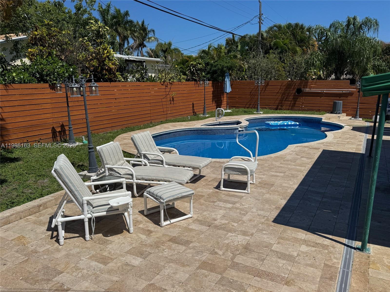 2355 Southeast 7th Street Pompano Beach, FL 33062 - Photo 6 of 31 a view of a patio with chairs and a table