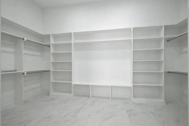 a view of an empty walk in closet