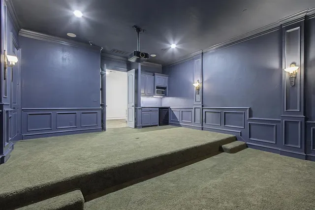 a view of a balcony with a potted plant and wooden floor