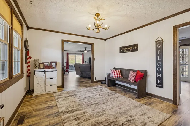 a kitchen that has a sink stainless steel appliances and cabinets