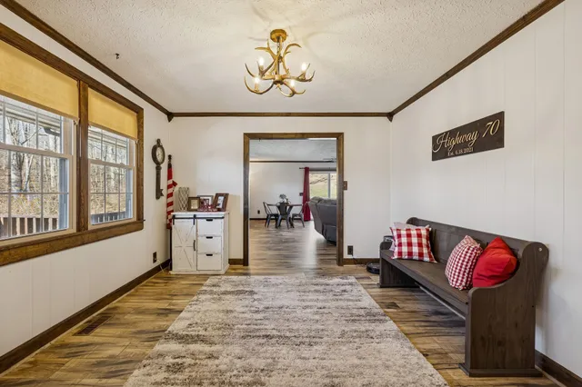 a view of a kitchen counter space a sink and wooden floor