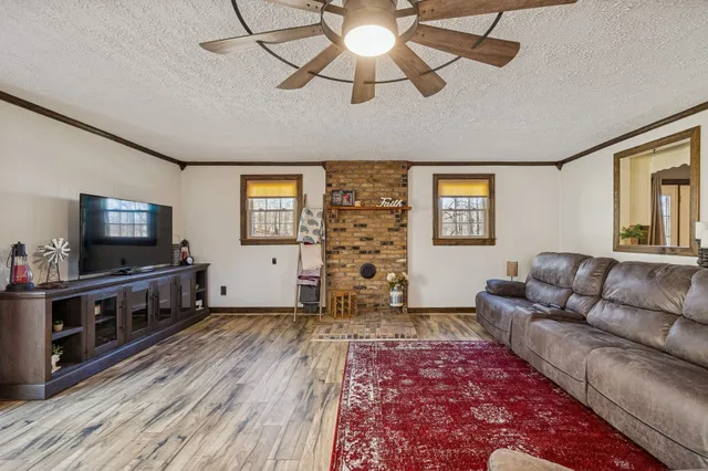 a bathroom with a toilet a sink and shower