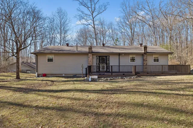 a view of a backyard with trees