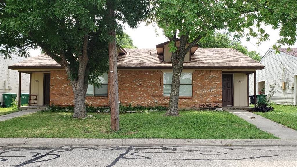 3321-3323 Fallmeadow Street Denton, TX 76207 - Photo 1 of 1 a front view of a house with a garden