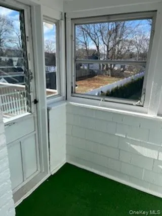 a view of balcony with wooden floor