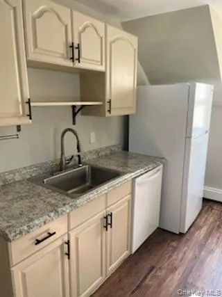 a kitchen with cabinets a sink and dishwasher