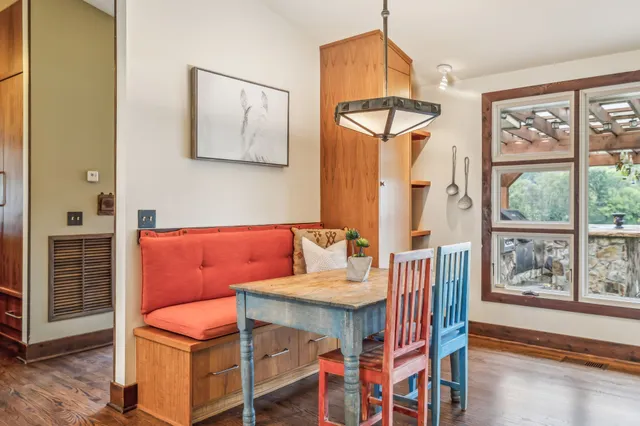 a bathroom with a sink a mirror a glass door a shower and vanity