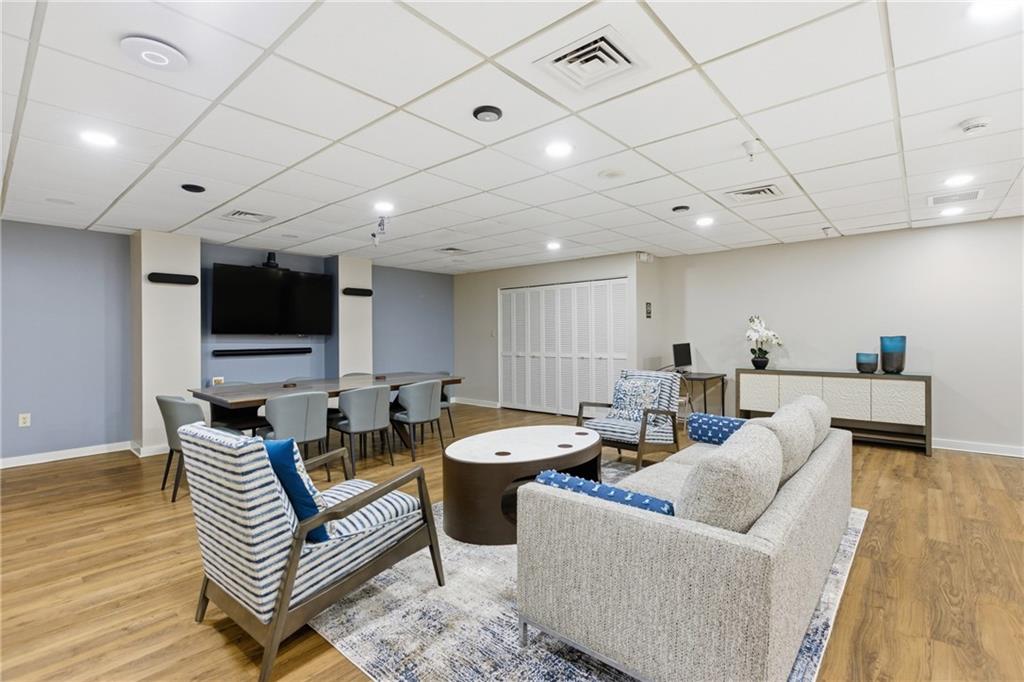 750 Washington Road, Unit 307 Pittsburgh, PA 15228 - Photo 16 of 24 a living room with furniture and a flat screen tv