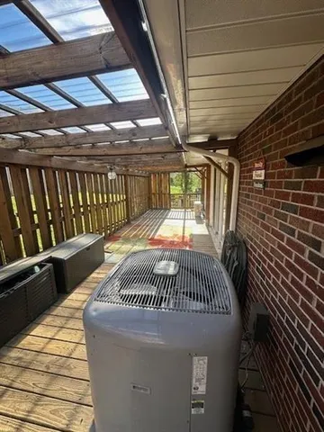 a view of a deck with wooden floor and outdoor space