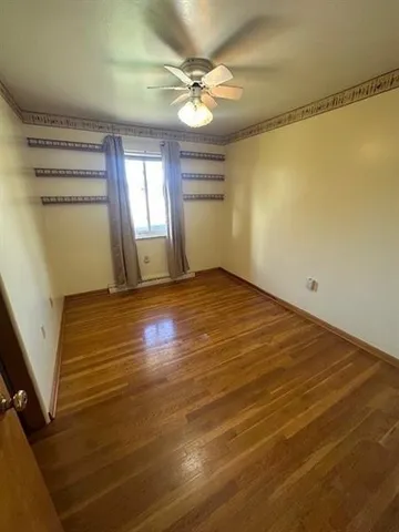 a view of a room with mini refrigerator and a chandelier