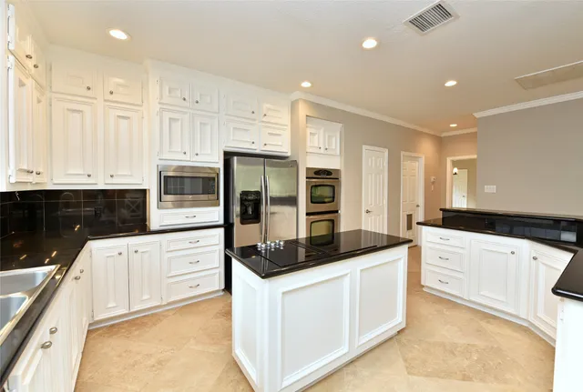 a view of a dining room with furniture large windows and wooden floor