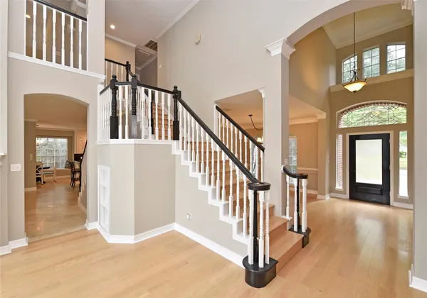 a view of a hallway with windows and stairs