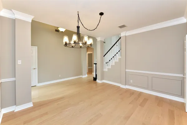 a view of an entryway with wooden floor